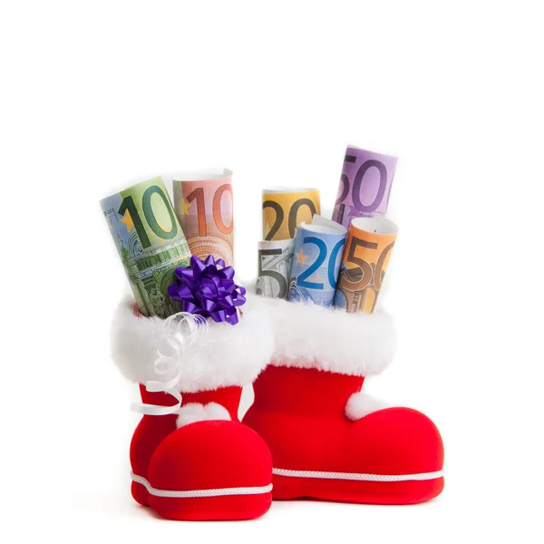 Euro im Stiefel von Weihnachtsmann auf weißem Hintergrund — Stockfoto