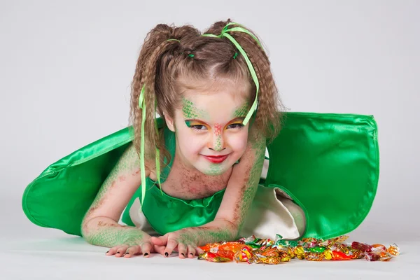 stock image The young girl painted like a dragon