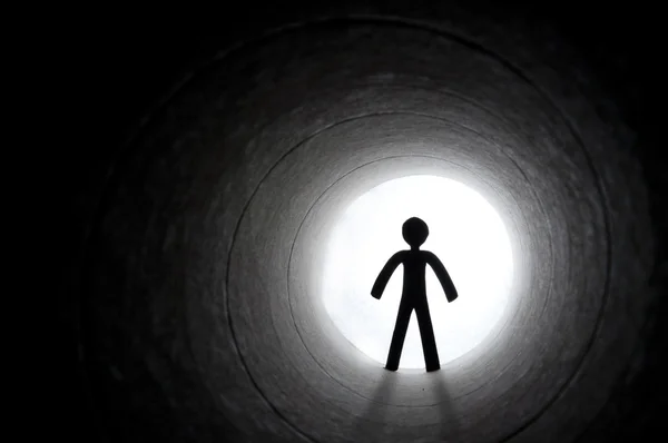 Stock image Male silhouette at the end of tunnel