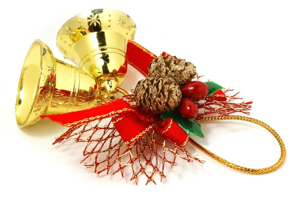 Bonitos sinos de Natal dourados com fita vermelha isolada sobre branco Imagem De Stock