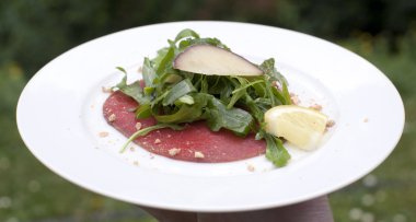 Bison carpaccio with fresh homemade blackcurrant jam, sautéed w