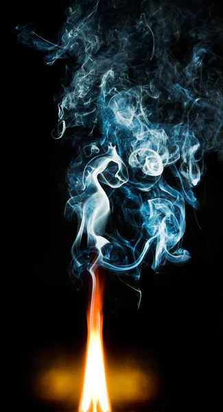 Fire and blue smoke — Stock Photo, Image