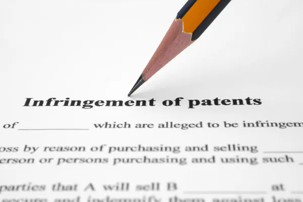 Intrång i patent — Stockfoto