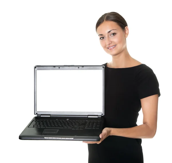 Jolie dame présentant un nouvel ordinateur portable sur blanc — Photo