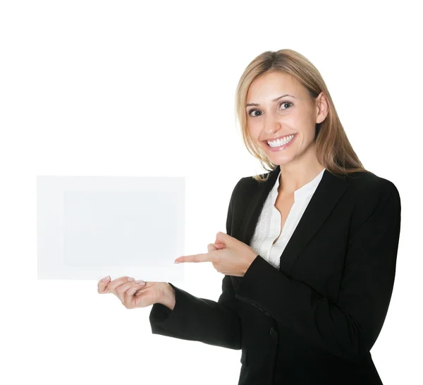 Business executive pointing at an empty billboard — Stock Photo, Image