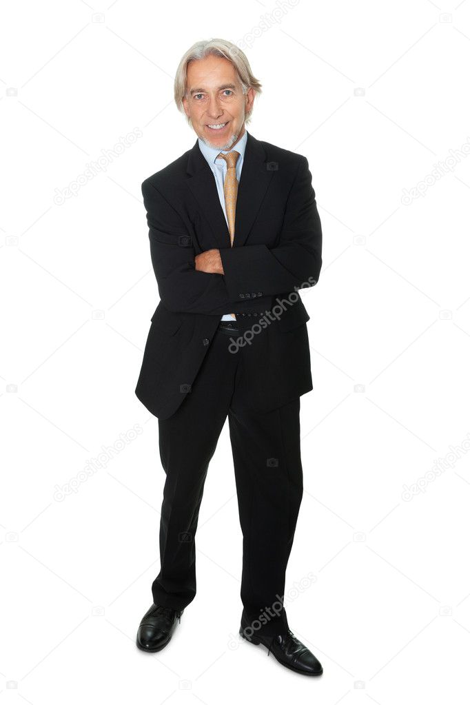 Mature businessman standing on white background