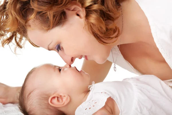 Loving mother playing with her little daughter — Stock Photo, Image