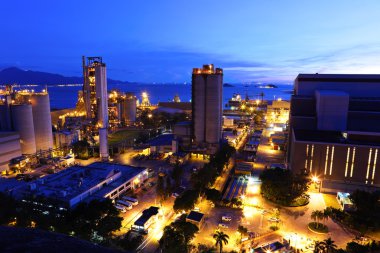 Industrial plant at dusk clipart