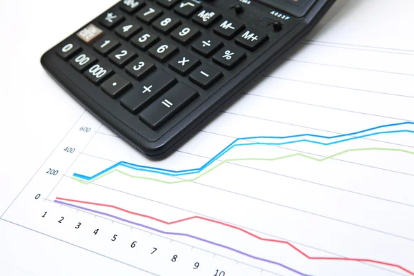 Business table with chart and calculator — Stock Photo, Image