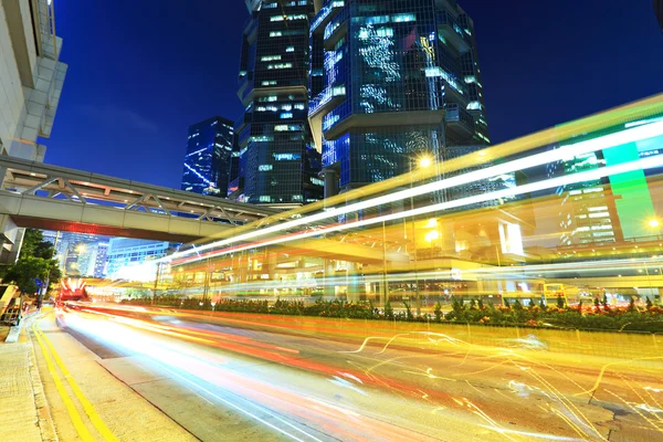 Car light trails in modern city — Stock Photo, Image