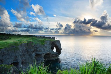 Sunset on the rocks , in Okinawa , Manzamo clipart