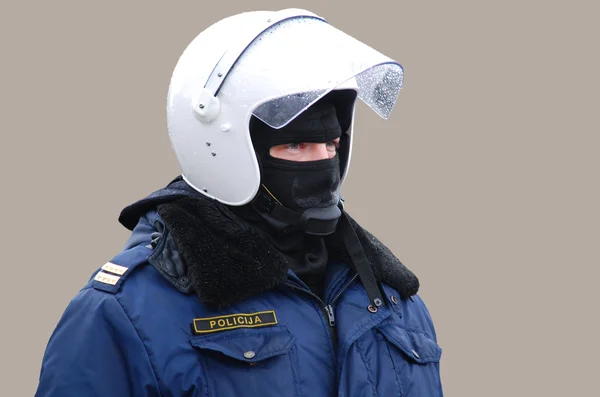 Policjant w formularzu ochronne, na szarym tle — Zdjęcie stockowe