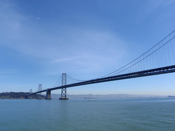 San Francisco side of Bay Bridge from boat sailing underneath on — Stock Photo, Image