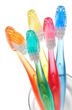 Multicolored toothbrushes clipart