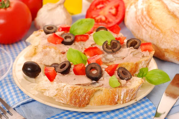 Crostini with pate and olives — Stok fotoğraf