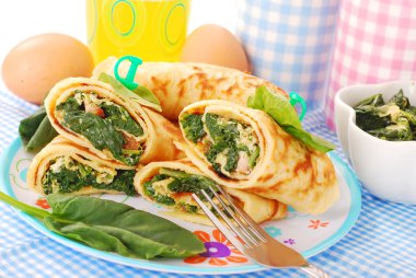 Pancakes with spinach and eggs clipart