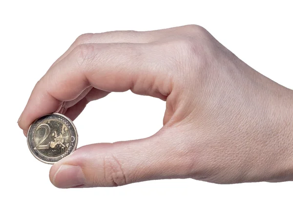Hand holds the coin 2 euros — Stock Photo, Image