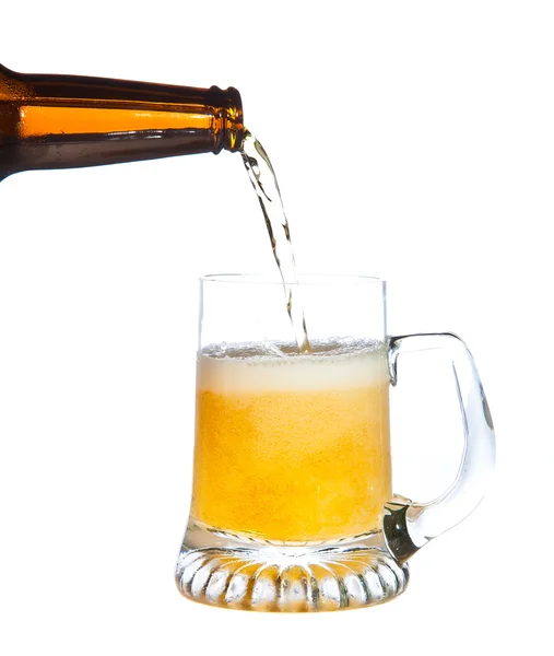 Pouring beer isolated on white — Stock Photo, Image