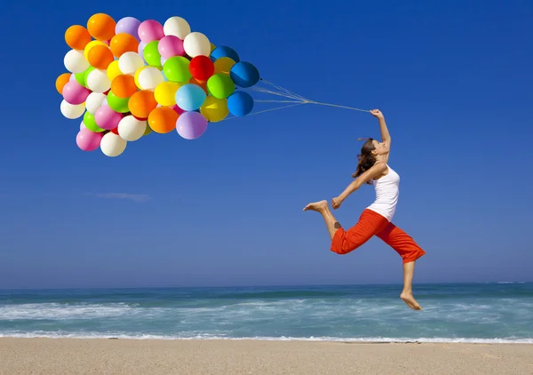 Springen mit Ballons Stockbild