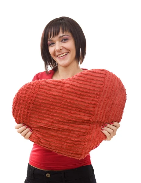 赤いハート型の枕を持つ女性 — ストック写真