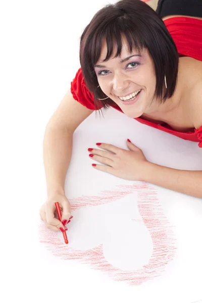 Женщина рисует в форме сердца — стоковое фото