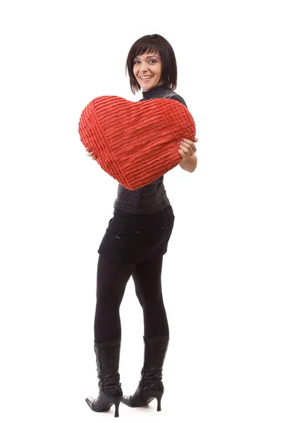 Donna con cuscino cuore — Foto Stock