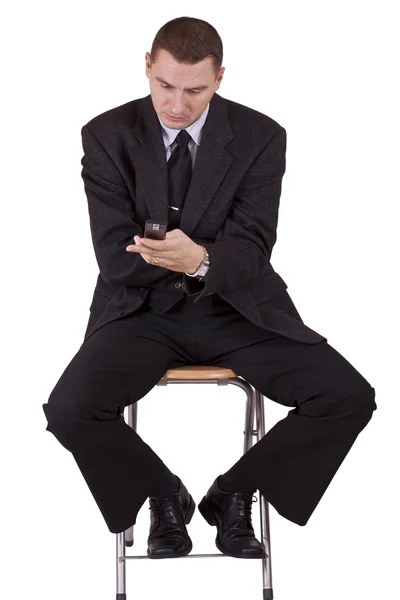 Hombre de negocios en un teléfono móvil — Foto de Stock