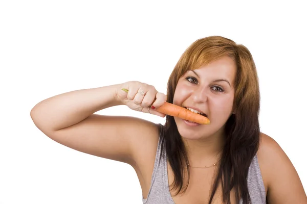 Женщина и морковь — стоковое фото