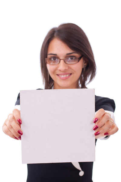 Portrait of a happy young woman showing a blank board over white isolated background