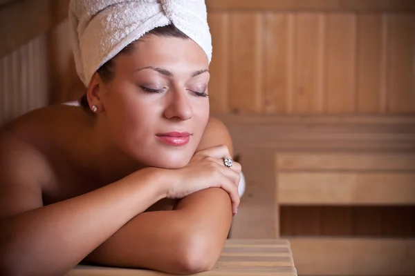 Woman relaxing in the sauna — Stock Photo, Image