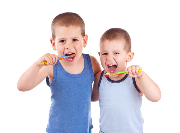 Jungen putzen sich die Zähne Stockbild