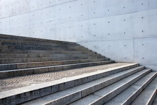 Grey stairs in front of a wall — Stock Photo, Image