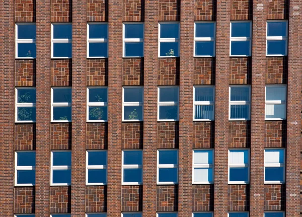 Facade of an old red brick building — Stock Photo, Image
