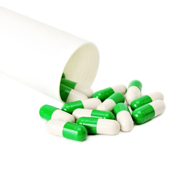 Pillole isolate su uno sfondo bianco — Foto Stock