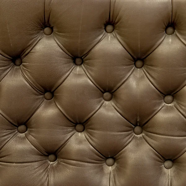 Tessitura tappezzeria in pelle del vecchio divano — Foto Stock