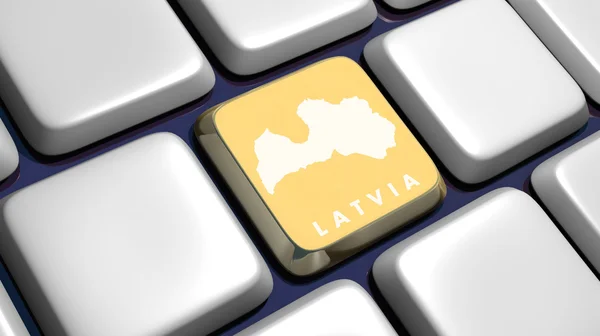 Клавиатура (деталь) с помощью карты Латвии — стоковое фото