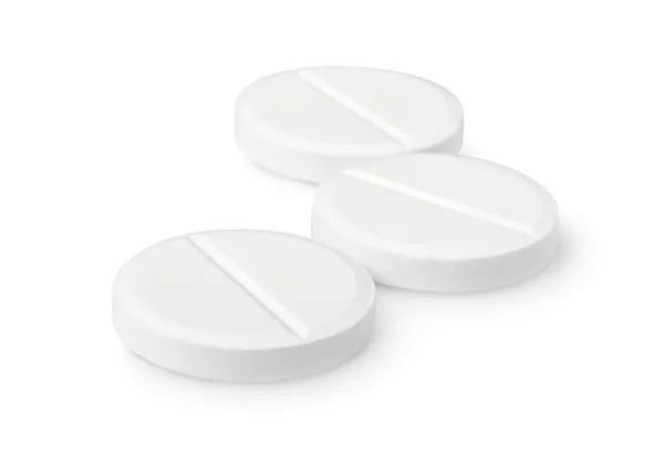 Três comprimidos isolados — Fotografia de Stock