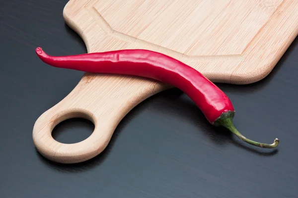 Capsicum and cooking utensils — Stock Photo, Image