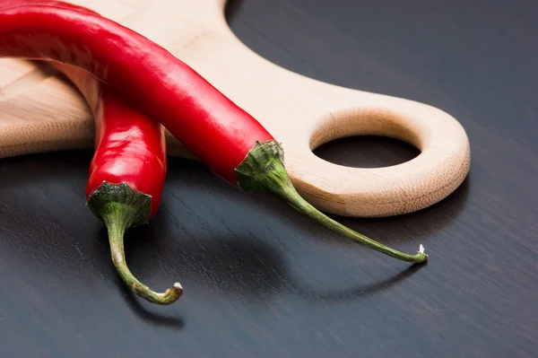 Paprika und Kochutensilien — Stockfoto
