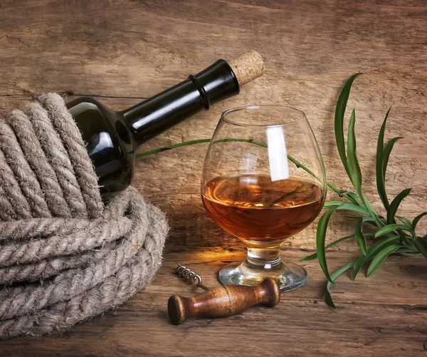 Bottle of wine wrapped with rope Stock Picture