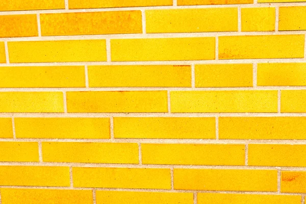 Falsche gelbe Ziegelwand — Stockfoto