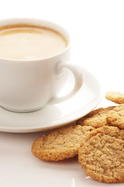 Šálek kávy a ovesné vločky cookies — Stock fotografie