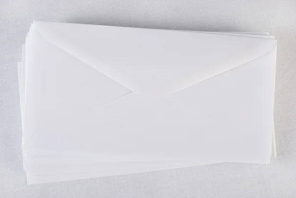 Stack of envelopes/letters on white background. Not isolated. — Stock Photo, Image