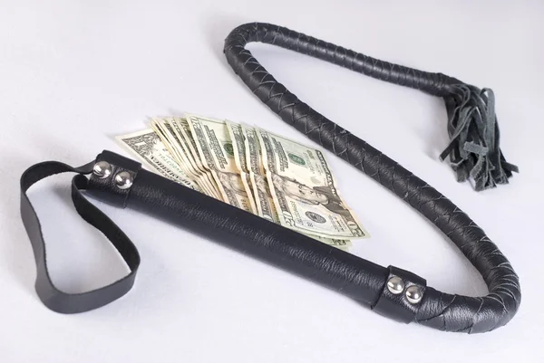 Black Single Tail Whip and money — Stock Photo, Image