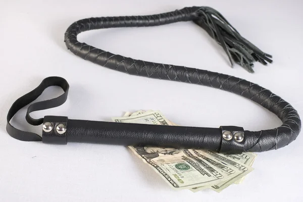 Black Single Tail Whip and money — Stock Photo, Image