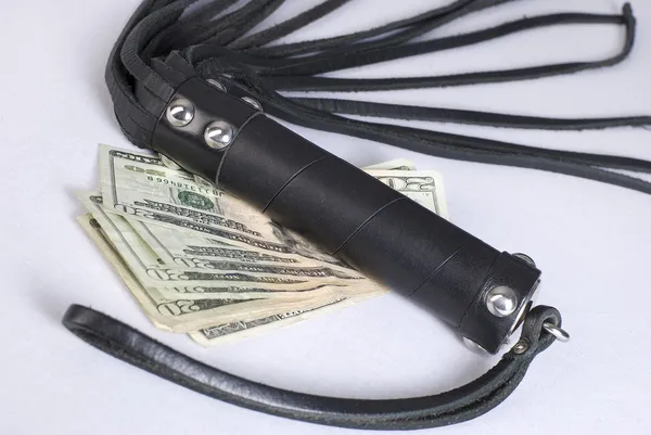 Strict Black Leather Flogging Whip and money. — Stock Photo, Image