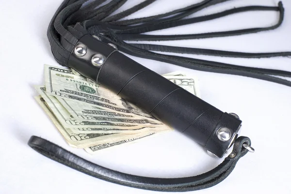 Black Leather Flogging Whip and money. — Stock Photo, Image