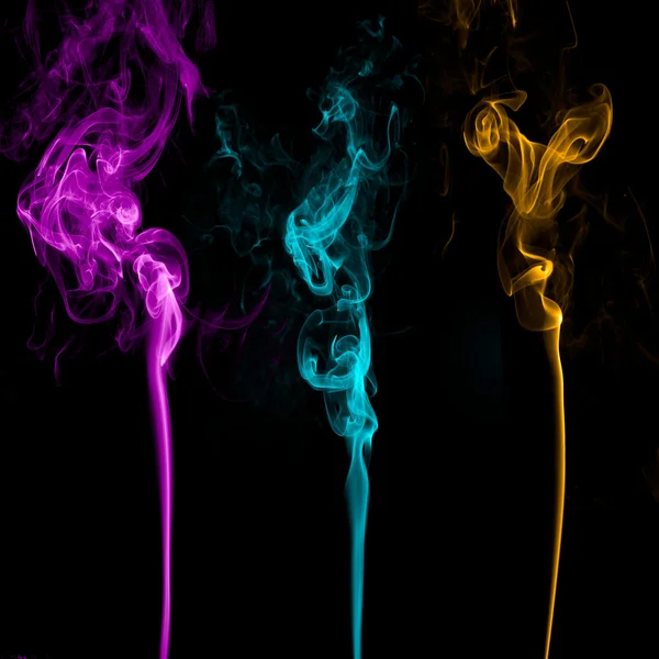 Три разноцветных дыма — стоковое фото