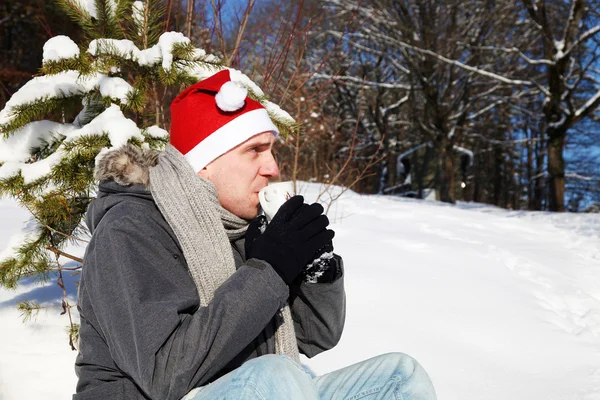Man sitting in the snow — Stock Photo, Image