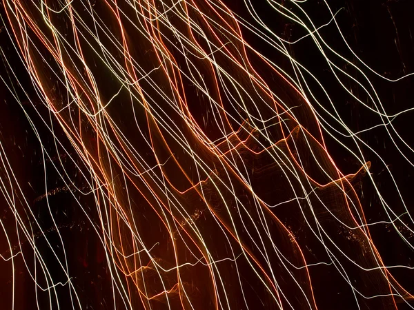 Leuchtende bunte Linien in einer Dunkelheit. — Stockfoto
